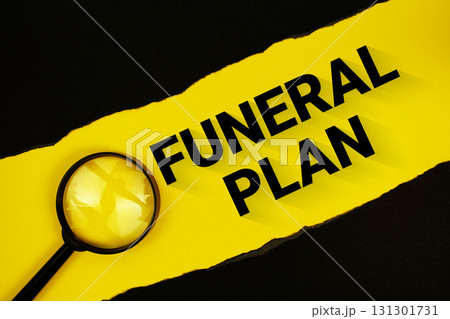 Funeral Plan text on yellow with black paper torn ripped and magnifying glass 131301731