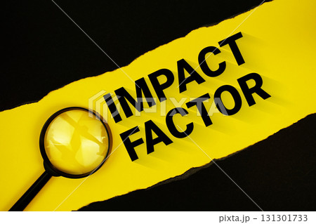 Impact Factor text on yellow with black paper torn ripped and magnifying glass 131301733