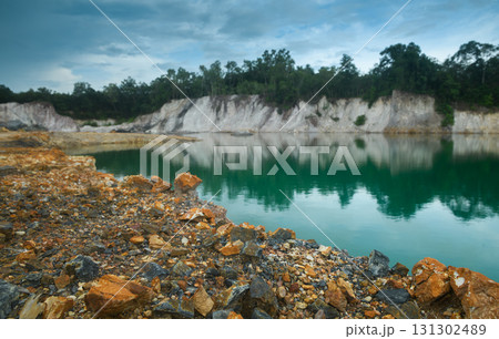 Abandoned quarry pond with rocky ground and turquoise water. Abandoned quarry pond with rocky ground and turquoise water. 131302489