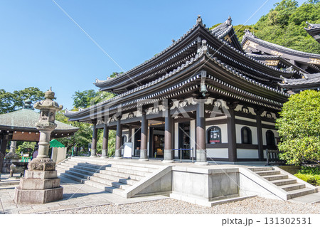 Traditional Japanese temple building in serene garden under clear sky at Kamakura, Kanagawa, Japan Traditional Japanese temple building in serene garden under clear sky at Kamakura, Kanagawa, Japan 131302531