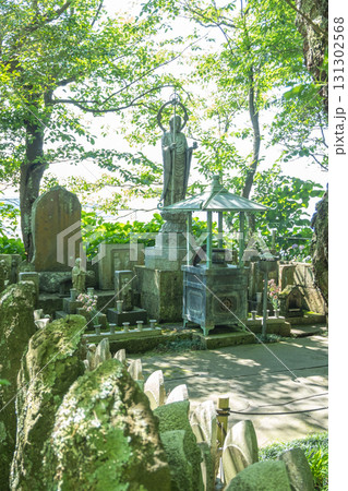 Buddhist stone statues and shrine in peaceful forest temple setting at Kamakura, Kanagawa, Japan Buddhist stone statues and shrine in peaceful forest temple setting at Kamakura, Kanagawa, Japan 131302568