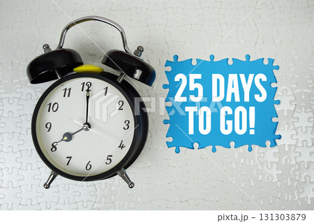 25 Days To Go! text with alarm clock on blue background 25 Days To Go! text with alarm clock on blue background 131303879