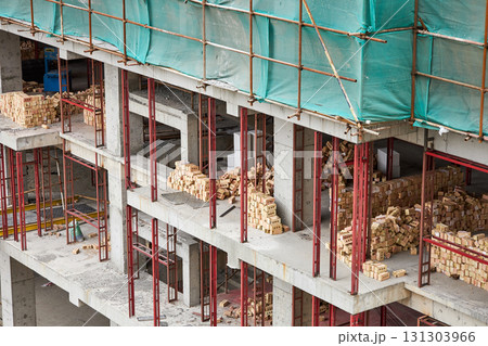 A construction site for an apartment building. Piles of bricks A construction site for an apartment building. Piles of bricks 131303966