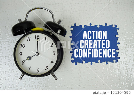 Action Created Confidence text with alarm clock on navy blue background Action Created Confidence text with alarm clock on navy blue background 131304596