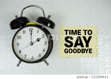 Time to Say Goodbye text with alarm clock on yellow background 131304613