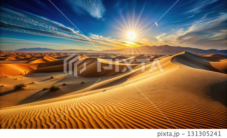 Endless sand dunes under vibrant sunset sky create serene landscape 131305241