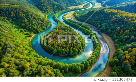 winding river surrounded by lush green forests and hills, showcasing nature beauty 131305478