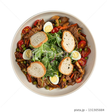 Isolated bowl of beef salad with egg and toast 131305884