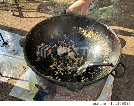 Cooking outdoor pilaf preparing traditional uzbekistan plov 131306052