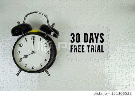 30 Days Free Trial text with alarm clock on white background 131306522