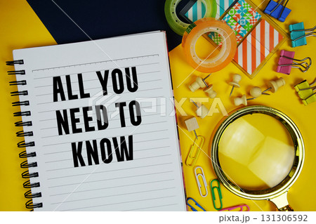 All You Need To Know text with magnifying glass and stationery on yellow background All You Need To Know text with magnifying glass and stationery on yellow background 131306592