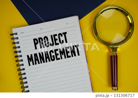 Project Management text with magnifying glass on yellow background Project Management text with magnifying glass on yellow background 131306717