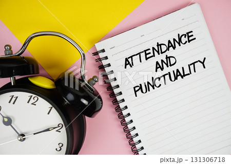 Attendance And Punctuality text written on notepad with alarm clock on pink background Attendance And Punctuality text written on notepad with alarm clock on pink background 131306718
