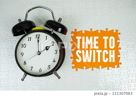 Time to Switch text with alarm clock on orange background 131307063