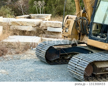 A crawler excavator stands at a construction site. Construction machinery and equipment. A crawler excavator stands at a construction site. Construction machinery and equipment. 131308433
