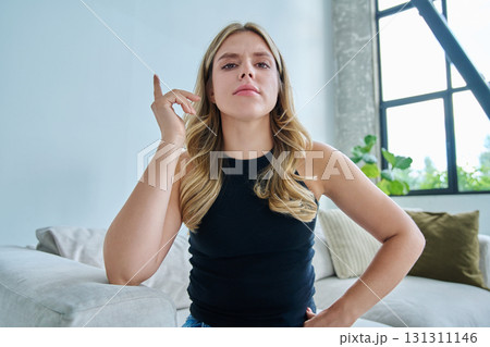 Web cam view of young woman talking looking in camera, online meeting, video call 131311146