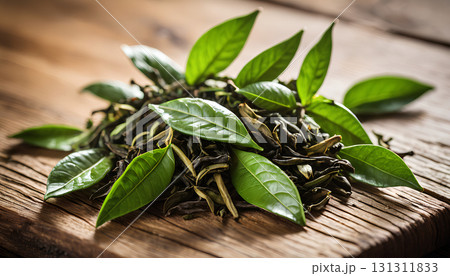 green tea leaves on wooden background green tea leaves on wooden background 131311833