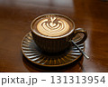 Cuppa of aromatic hot cafe mocha with lovely heart shaped art served in brown cup and saucer on brown table top 131313954