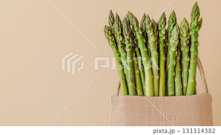 Asparagus vegetable on eco sack bag seagrass for grocery packaging on solid background 131314382