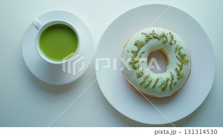 Green matcha donut gluten free for healthy snack time on white plate 131314530