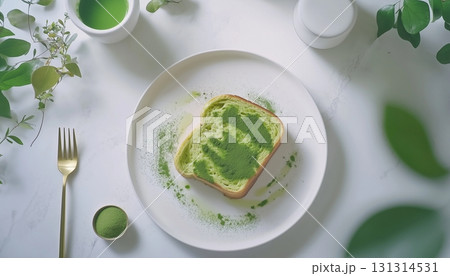 Matcha toast green topping flour for simple breakfast on white plate 131314531