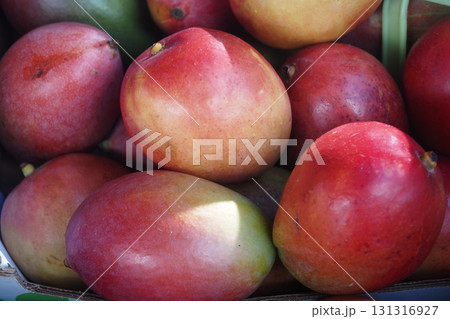 Fresh mangoes displayed at a local market in summer Fresh mangoes displayed at a local market in summer 131316927