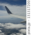 飛行機の翼と雲海を上空から眺めた風景 | Aerial View of Airplane Wing  131317200