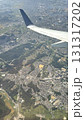飛行機の翼と雲海を上空から眺めた風景 | Aerial View of Airplane Wing  131317202