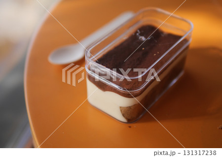 Delicious dessert served in a clear container on a table Delicious dessert served in a clear container on a table 131317238
