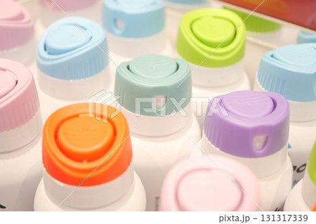Colorful bottle caps arranged neatly on display Colorful bottle caps arranged neatly on display 131317339