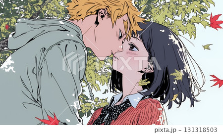 秋の紅葉の下でキスをしている若い恋人たち 131318503