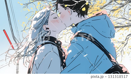 秋の紅葉の下でキスをしている若い恋人たち