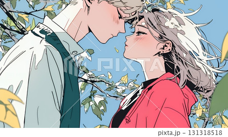 秋の紅葉の下でキスをしている若い恋人たち