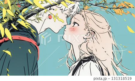 秋の紅葉の下でキスをしている若い恋人たち