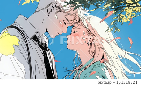 秋の紅葉の下でキスをしている若い恋人たち