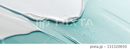 Artistic paint blending in vibrant turquoise and white on a canvas 131320650