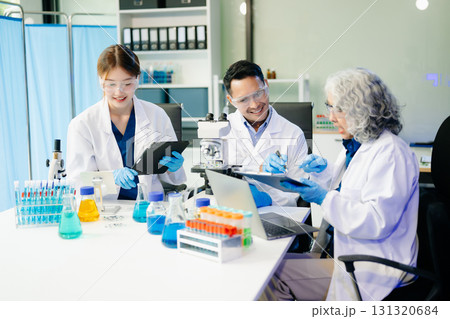 Dynamic science lab where a team of scientists collaborates on research, testing, and innovation Dynamic science lab where a team of scientists collaborates on research, testing, and innovation 131320684