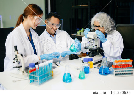 Dynamic science lab where a team of scientists collaborates on research, testing, and innovation 131320689