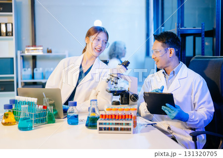 Scientist team meeting and writing analysis results in the laboratory study Scientist team meeting and writing analysis results in the laboratory study 131320705