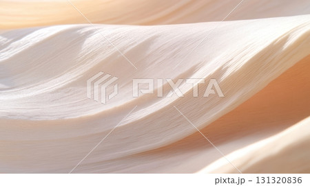 Soft silk fabric gracefully draped under natural light in a gentle flow 131320836