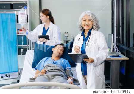 Hospital Ward Male and  Male Professional Asian Doctors Talk with a Patient, Give Health Care Advice, 131320937