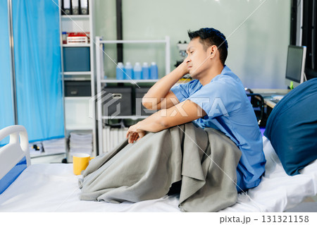 Concerned patient in a hospital bed, capturing emotions tied to medical care, recovery, 131321158