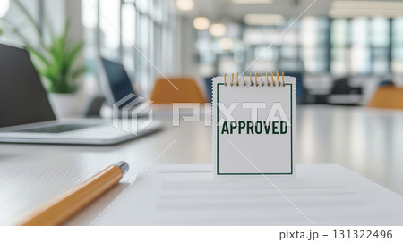 Approved note on desk in modern office, symbolizing success and achievement 131322496