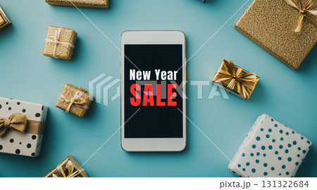 New Year sale announcement on smartphone with festive gifts 131322684