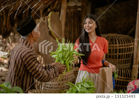 Cultural exchange at a traditional market involves vibrant interactions filled with joy Cultural exchange at a traditional market involves vibrant interactions filled with joy 131325493