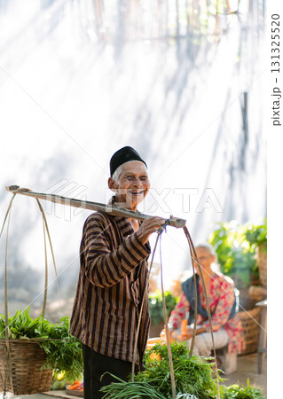 Elderly Farmer Smiling Happily While Surrounded by Fresh Produce in a Traditional Setting Elderly Farmer Smiling Happily While Surrounded by Fresh Produce in a Traditional Setting 131325520