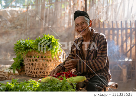 An Elderly Farmer Smiling Contentedly Amidst a Bounty of Fresh Vegetables in a Rustic Setting An Elderly Farmer Smiling Contentedly Amidst a Bounty of Fresh Vegetables in a Rustic Setting 131325523
