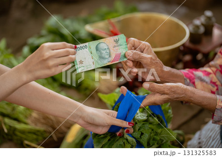 A Market Transaction involves exchanging money for fresh produce, such as fruits and vegetables A Market Transaction involves exchanging money for fresh produce, such as fruits and vegetables 131325583