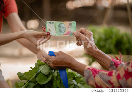 Local Transaction An Elderly Vendor Engaging the Community by Selling Fresh Produce 131325593