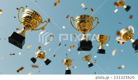 A collection of gold trophies floats in the air, representing educational success and the pursuit of learning A collection of gold trophies floats in the air, representing educational success and the pursuit of learning 131325620